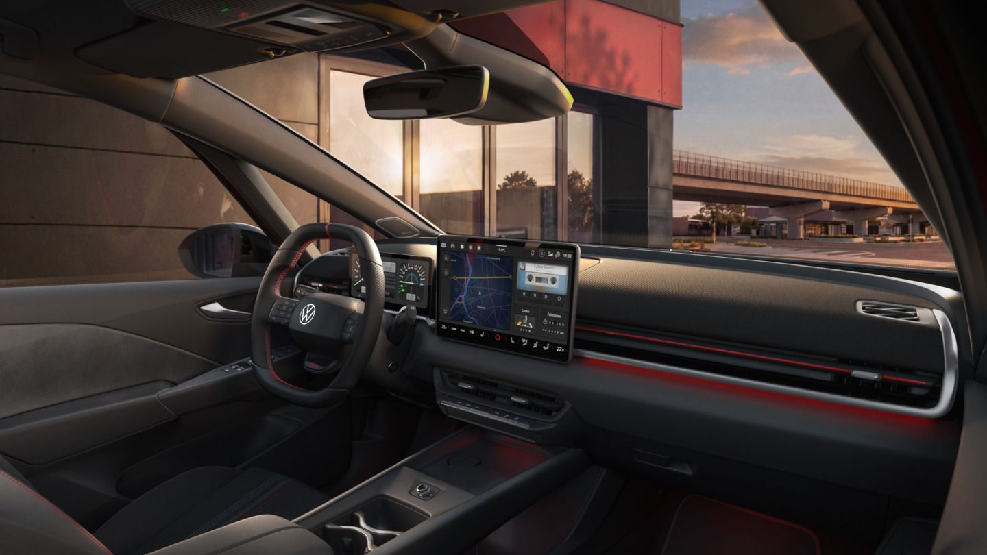 [AI-modified] – Vista do sistema Infotainment e do acabamento interior de um VW ID.3 GTI pouco antes do pôr do sol.