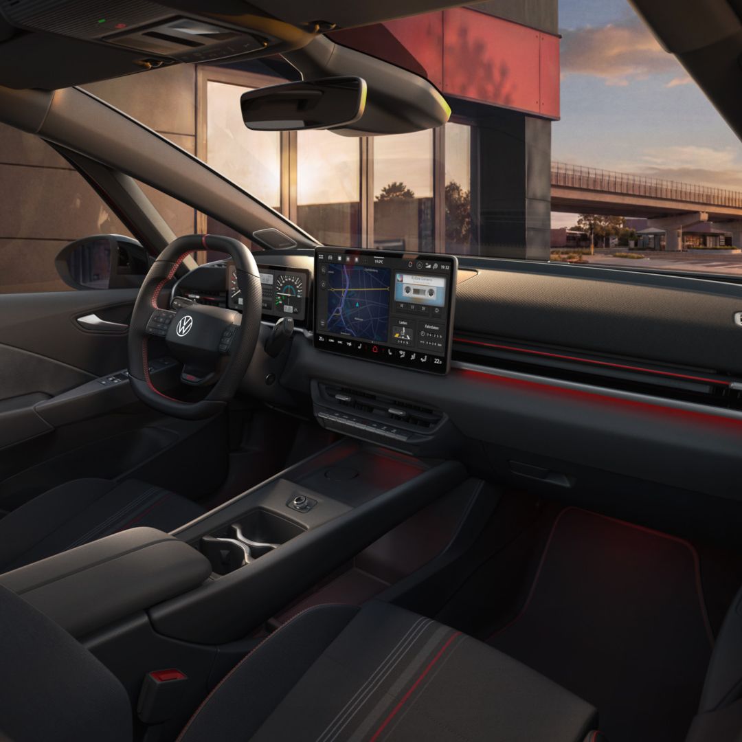 [AI-modified] – Vista do sistema Infotainment e do acabamento interior de um VW ID.3 GTI pouco antes do pôr do sol.