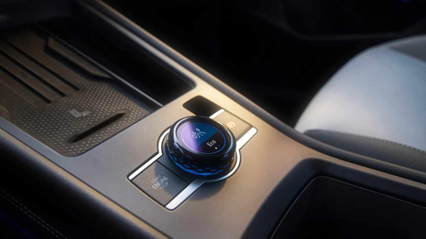 Vista detalhada do comando de modos de condução na consola central do VW T-Roc Style.