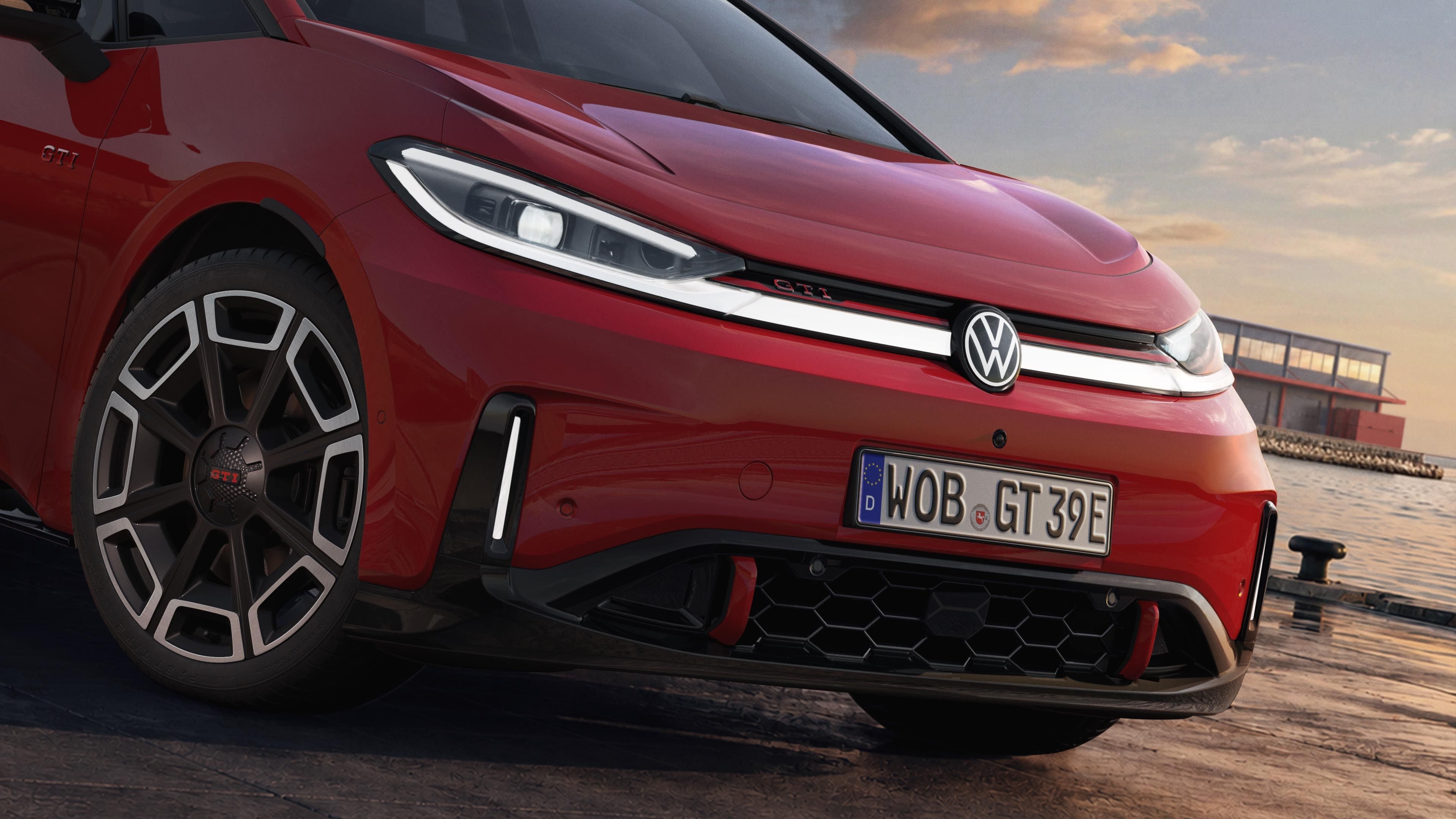 [AI-modified] – Grande plano da parte dianteira de um VW ID.3 GTI estacionado, com os faróis e o logótipo acesos.