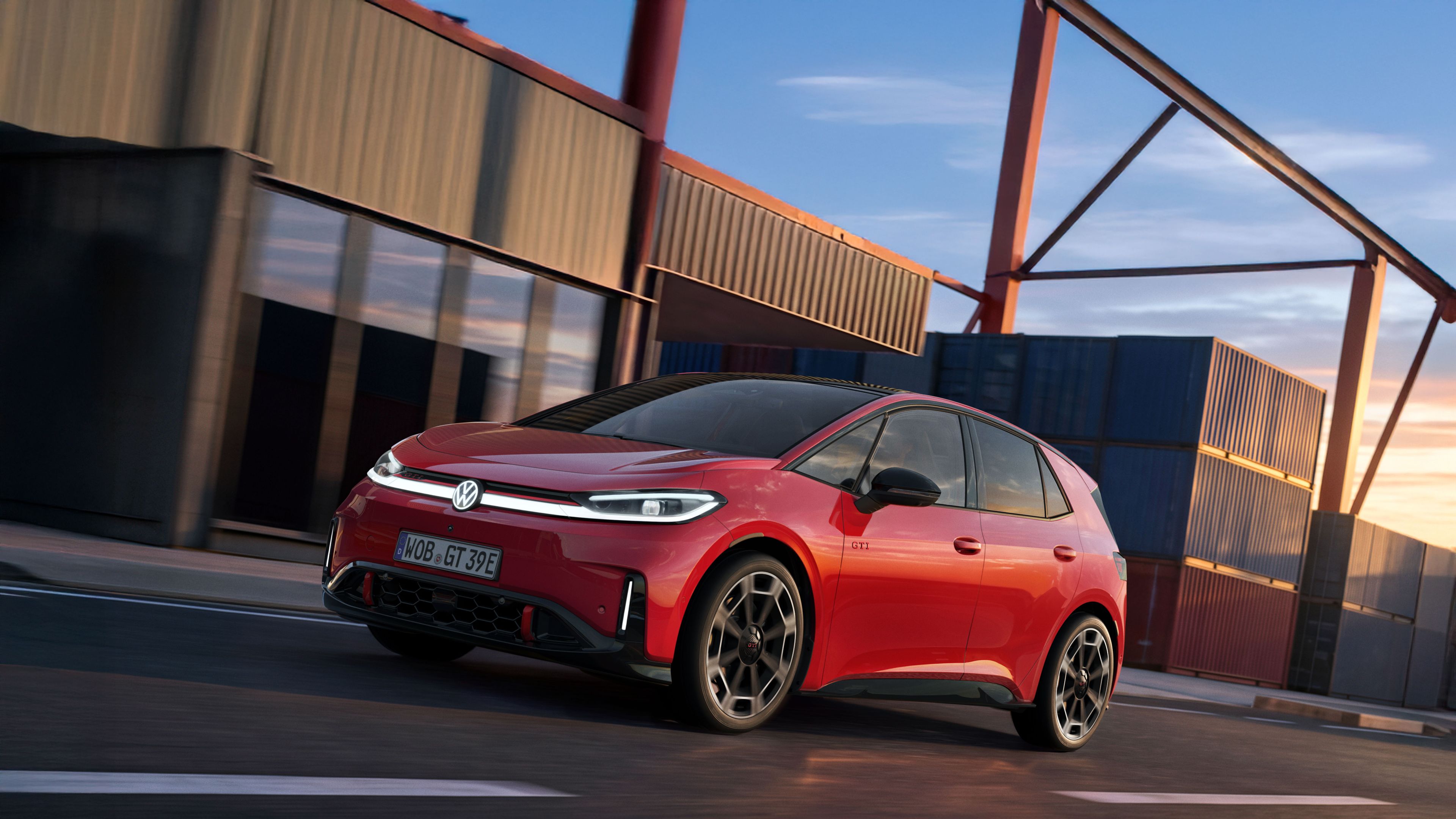 [AI-modified] – Vista frontal de um VW ID.3 GTI, com faróis acesos e logótipo, em frente a um edifício.