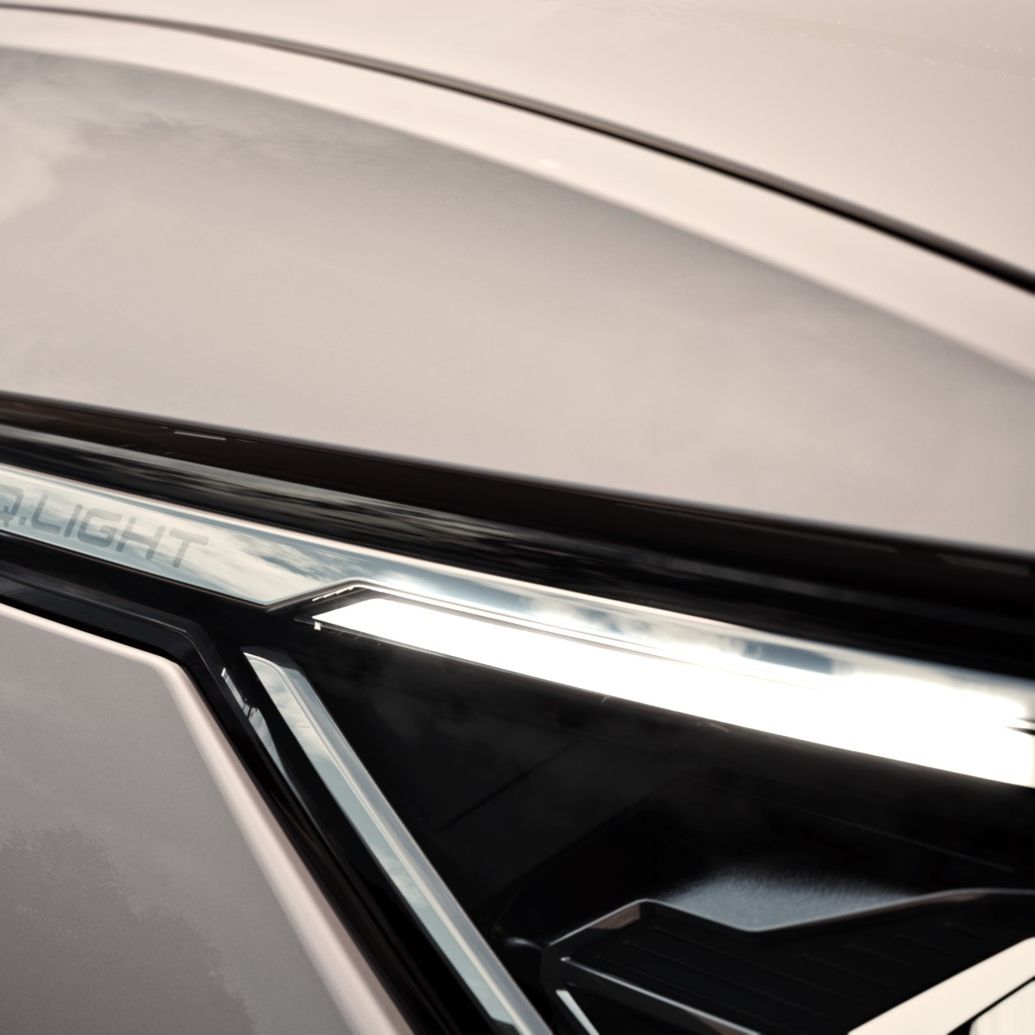 Die LED-Matrixscheinwerfer im Fokus eines weißen VW Golf Variant.